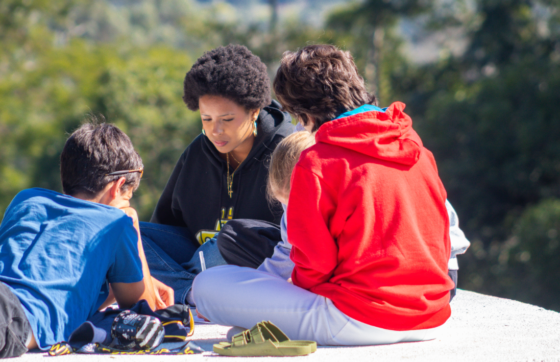 Young adult mentoring youth in a CISV camp.